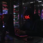 hacker in room of network servers